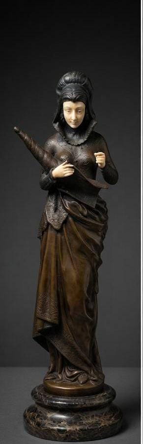 Bronze sculpture of woman in Medieval-style attire