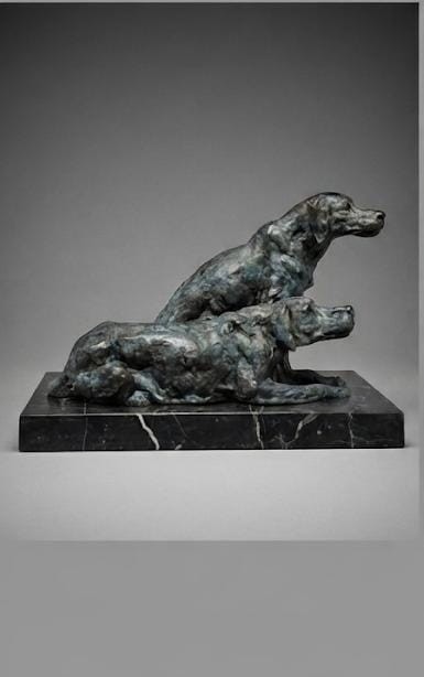 Bronze sculpture of 2 seated dogs
